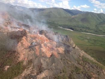 An aerial view of the Windfall Mountain Fire with the Tatonduk River in the background. National Park Service photo by Linda Stromquist. 